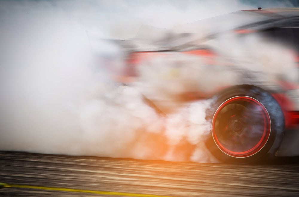 Blurred,Race,Car,Drifting,On,Speed,Track,On,Twilight,Background.