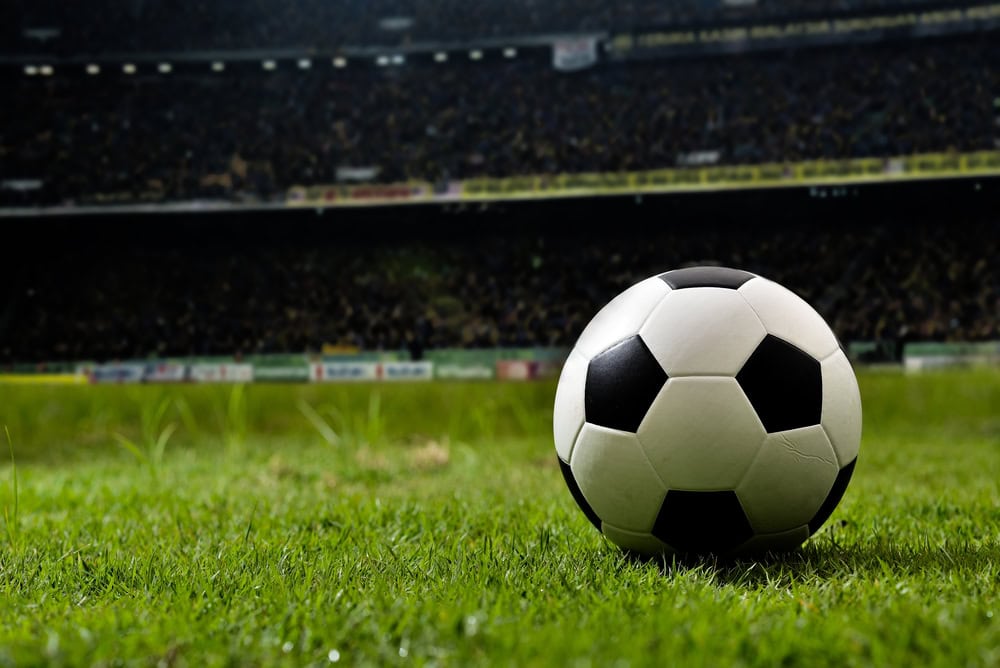Soccer,On,Grass,And,Stadium.